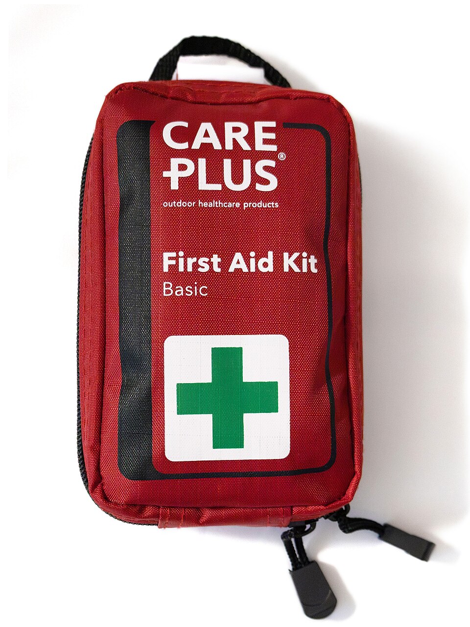 A red zippered pouch labeled First Aid Kit with a green cross, for storm prep in Coralville, IA
